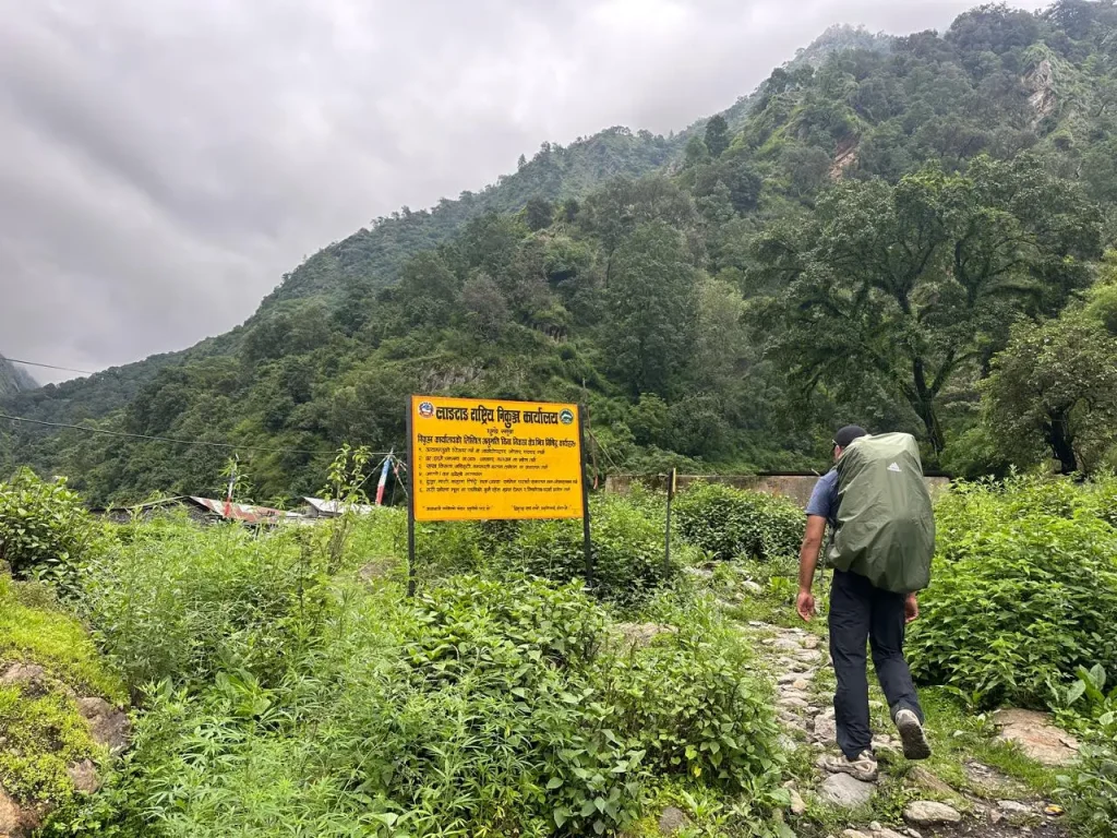Trekking trail near the Langtang National Park information board in Nepal.