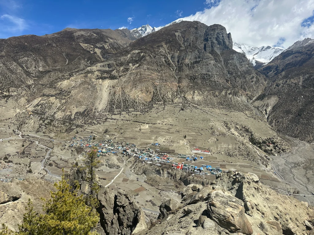 Manang Village, Nepal: Wide landscape view of Manang village in Nepal surrounded by rugged mountains